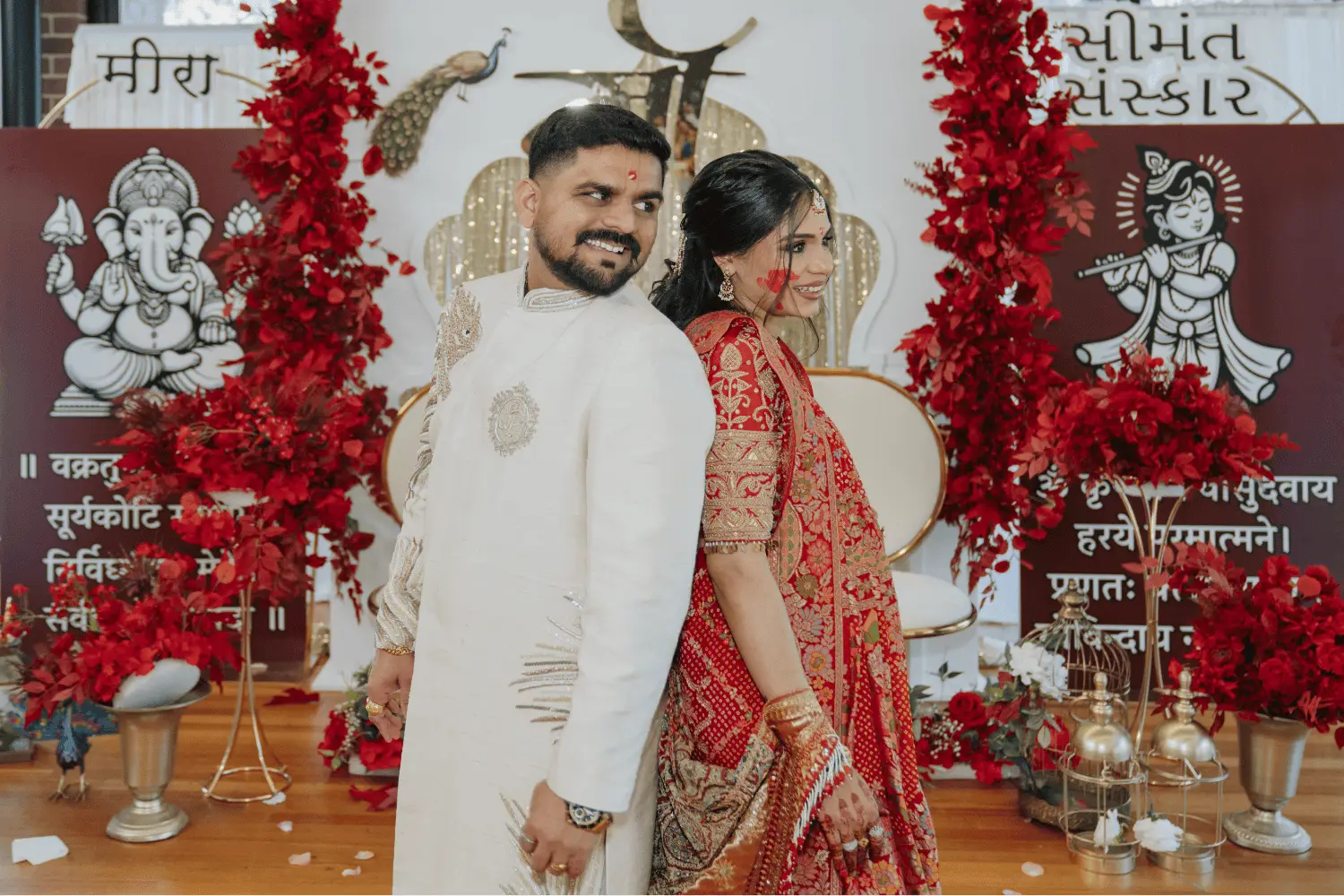 Joyful Indian bride and groom during wedding ritual with colorful background.